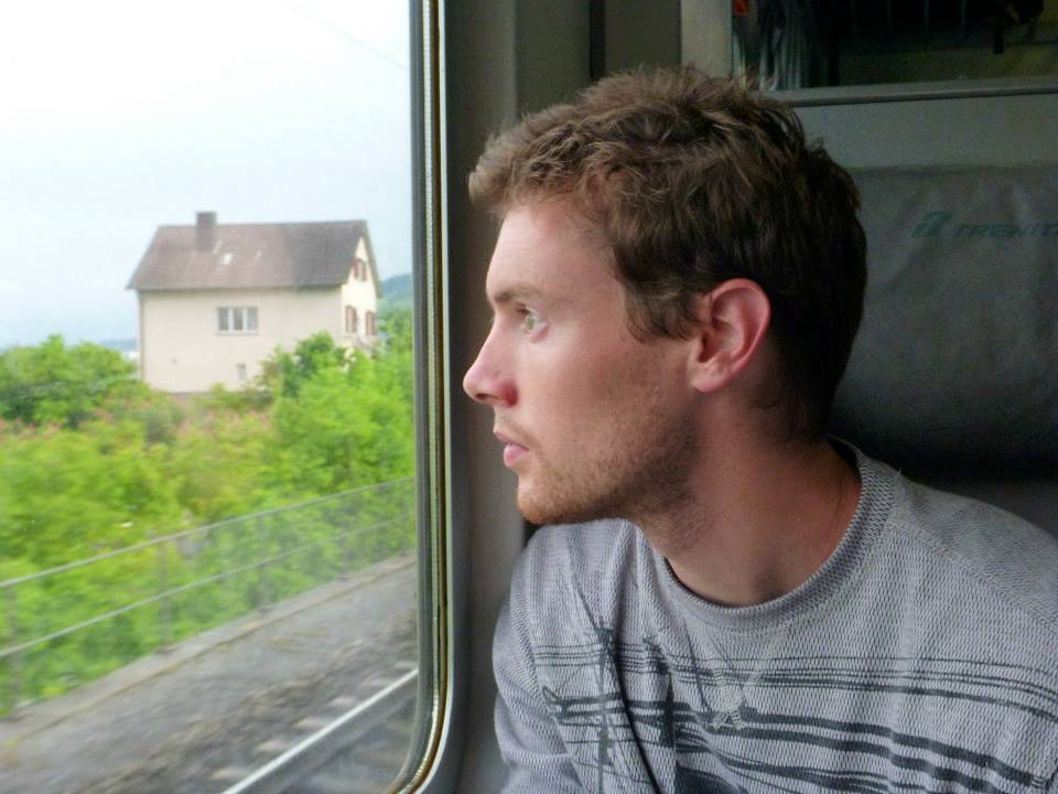 Derek looking out of a train window